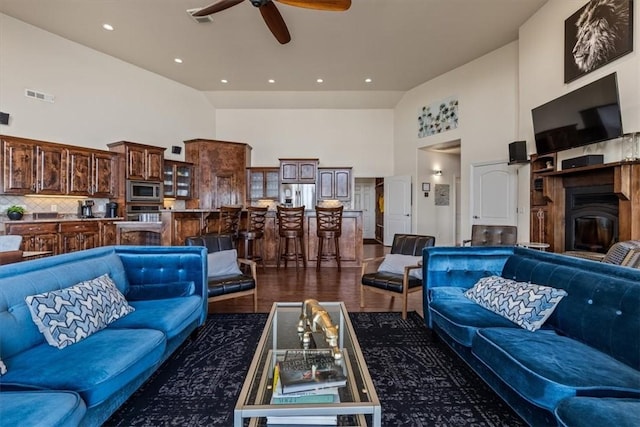 15100 Railroad Cut Rd, Rogers, AR 72756 - living room with high vaulted ceiling, a ceiling fan, and dark wood-style floors