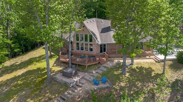 15100 Railroad Cut Rd, Rogers, AR 72756 - rear view of house featuring a wooden deck, a yard, and a shingled roof
