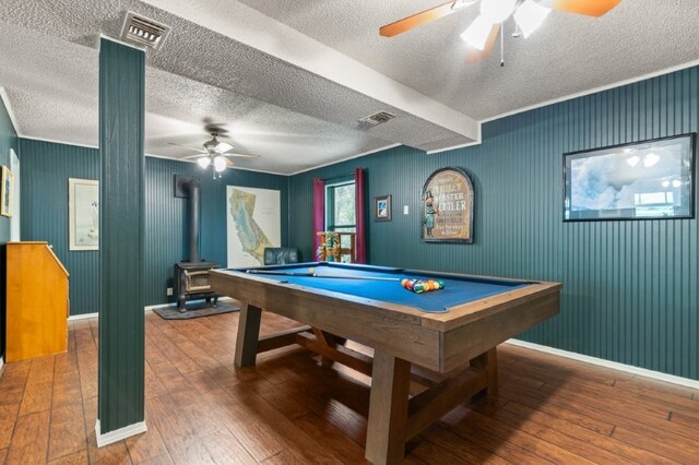 17934 Timberlake Trl, Rogers, AR 72756 - game room with ceiling fan, a textured ceiling, a wood stove, hardwood / wood-style floors, and baseboards