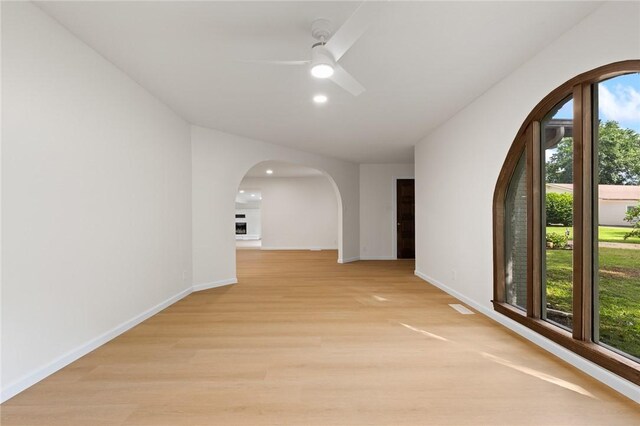 3916 O Street Ter, Harrison, AR 72601 - hall with arched walkways, plenty of natural light, recessed lighting, baseboards, and light wood-style floors