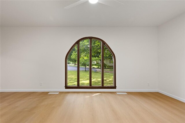 3916 O Street Ter, Harrison, AR 72601 - unfurnished room with light wood finished floors, ceiling fan, and baseboards