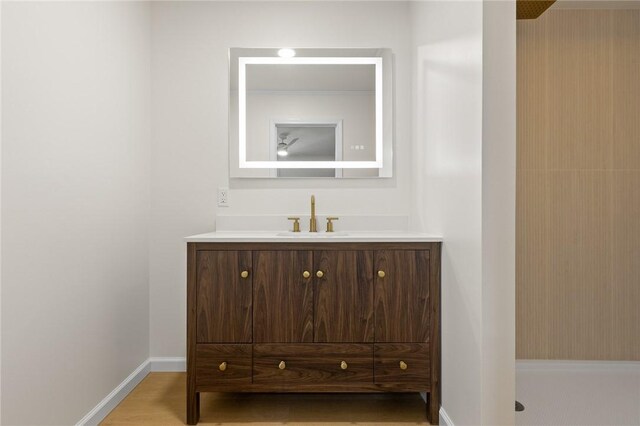3916 O Street Ter, Harrison, AR 72601 - bathroom featuring vanity, baseboards, and a shower