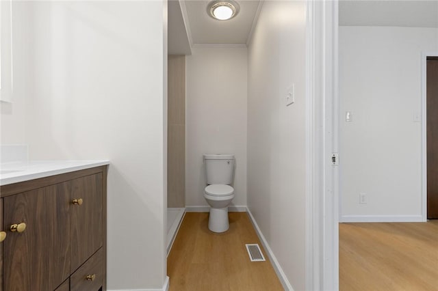 3916 O Street Ter, Harrison, AR 72601 - bathroom with wood finished floors, vanity, toilet, and baseboards