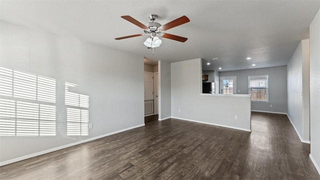 3357 Justice Dr, Springdale, AR 72764 - unfurnished living room with dark wood finished floors, ceiling fan, baseboards, and recessed lighting