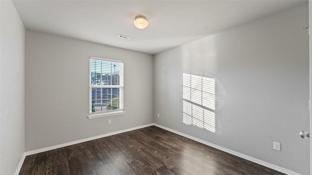 3357 Justice Dr, Springdale, AR 72764 - unfurnished room with dark wood finished floors and baseboards