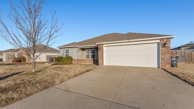 3357 Justice Dr, Springdale, AR 72764 - ranch-style house with brick siding, a garage, and concrete driveway