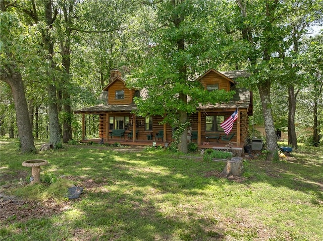 5287 Forgeson Rd, Harrison, AR 72601 - view of front of property with covered porch, a front lawn, log siding, and a chimney