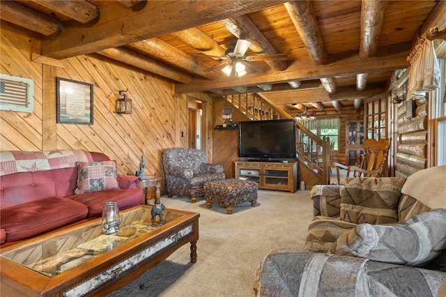 5287 Forgeson Rd, Harrison, AR 72601 - carpeted living room featuring wooden ceiling with exposed beams, stairs, a ceiling fan, and wooden walls
