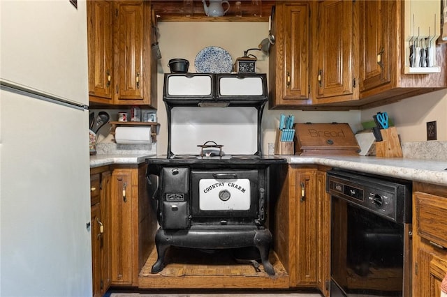 5287 Forgeson Rd, Harrison, AR 72601 - kitchen featuring brown cabinets, light countertops, freestanding refrigerator, and dishwasher