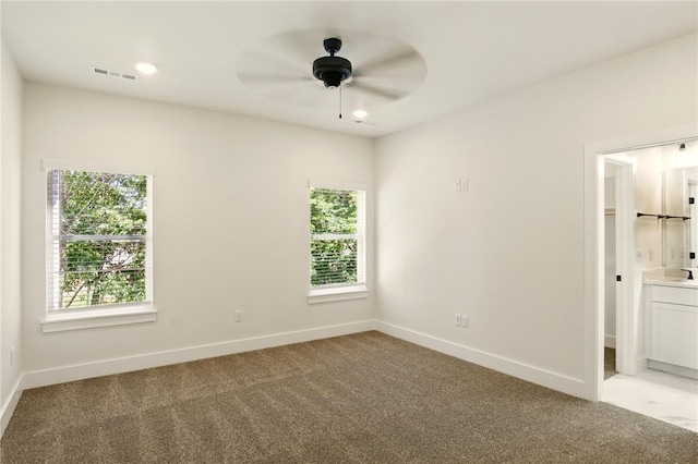 4551 Gibson St, Springdale, AR 72762 - empty room featuring healthy amount of natural light, light colored carpet, and a ceiling fan