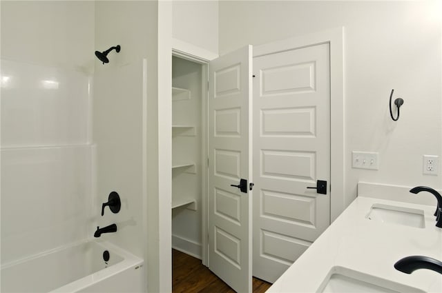 4551 Gibson St, Springdale, AR 72762 - bathroom with shower / tub combination, wood finished floors, and double vanity