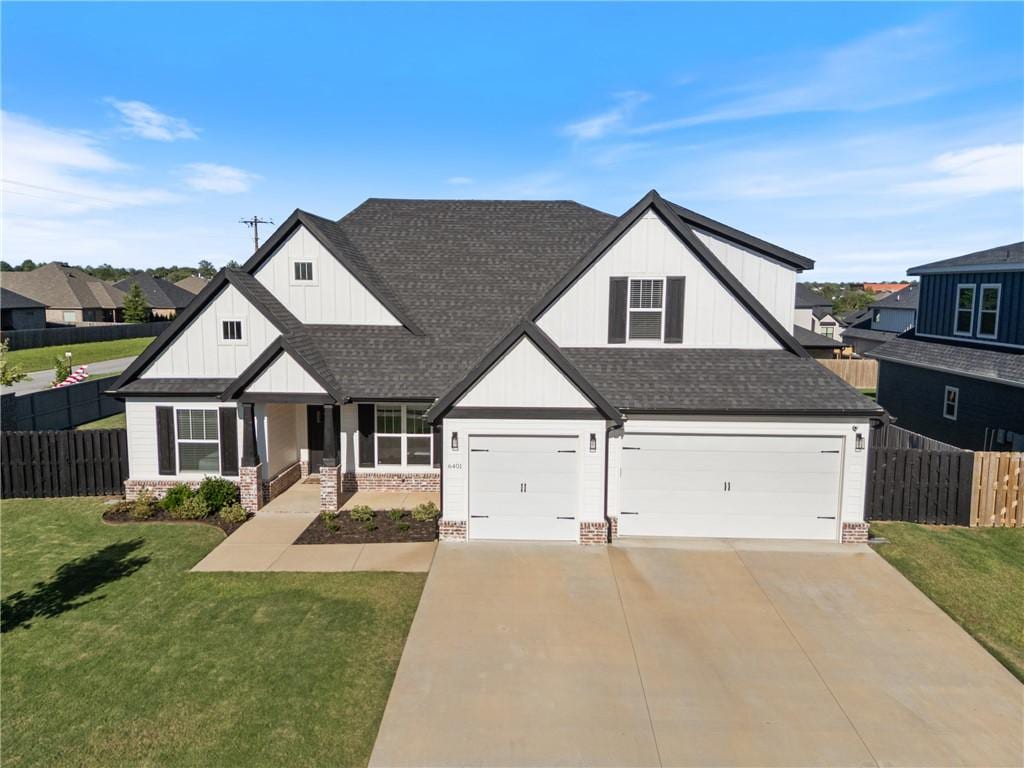 6401 60th St, Rogers, AR 72758 - modern farmhouse featuring a shingled roof, an attached garage, driveway, and board and batten siding