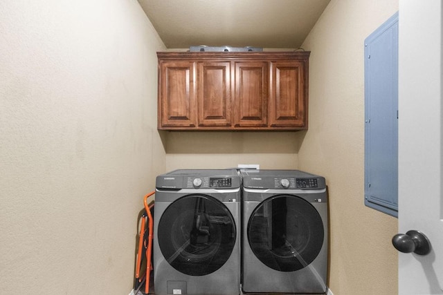 4007 W Song Bird Pl, Fayetteville, AR 72704 - washroom with washing machine and clothes dryer, cabinet space, and baseboards