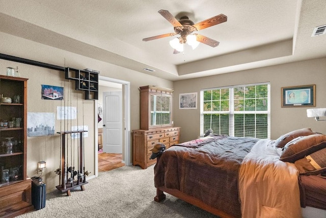 4007 W Song Bird Pl, Fayetteville, AR 72704 - carpeted bedroom with a raised ceiling and a ceiling fan