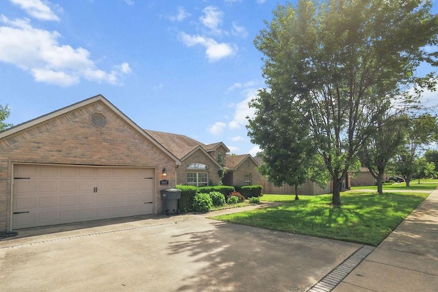 4007 W Song Bird Pl, Fayetteville, AR 72704 - traditional home featuring brick siding, a front yard, concrete driveway, and an attached garage