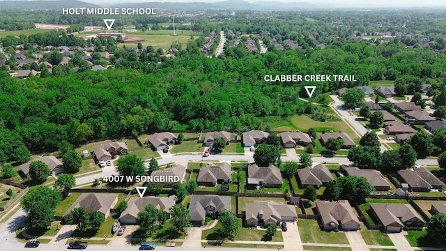 4007 W Song Bird Pl, Fayetteville, AR 72704 - aerial view of residential area featuring a forest