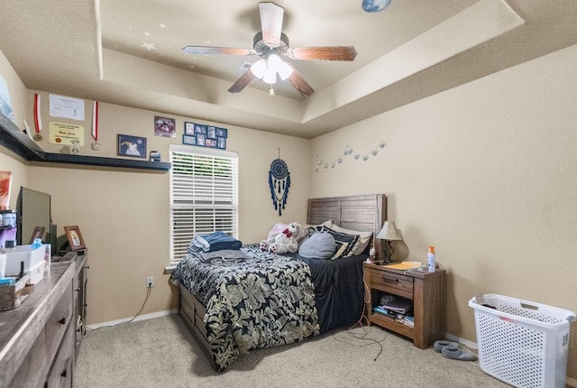4007 W Song Bird Pl, Fayetteville, AR 72704 - bedroom with a tray ceiling, baseboards, carpet flooring, and ceiling fan