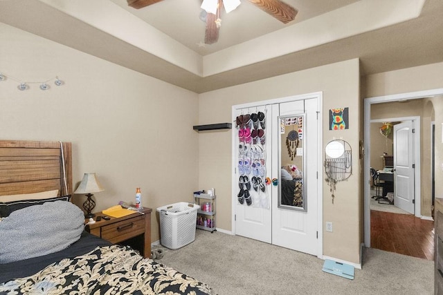 4007 W Song Bird Pl, Fayetteville, AR 72704 - bedroom with carpet, a closet, baseboards, and a ceiling fan