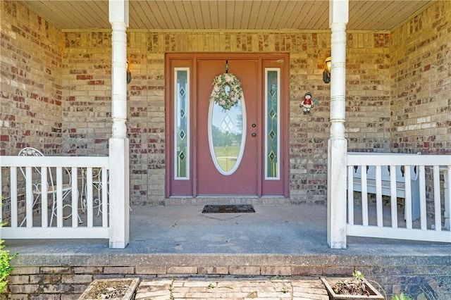 1480 Dallas St, Gravette, AR 72736 - entrance to property with covered porch and brick siding