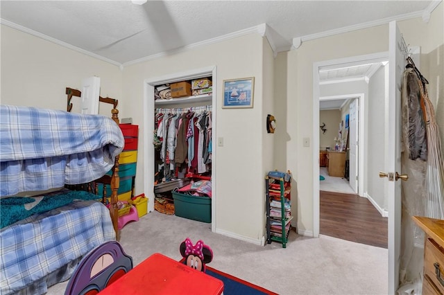 1480 Dallas St, Gravette, AR 72736 - bedroom featuring crown molding, a closet, carpet floors, and baseboards