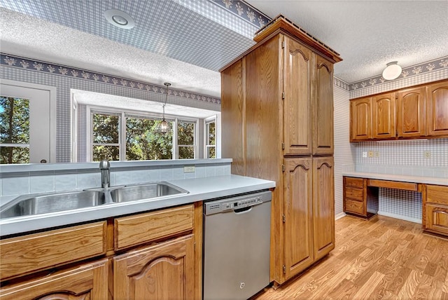 22 Marina Cir, Bella Vista, AR 72715 - kitchen with stainless steel dishwasher, a textured ceiling, wallpapered walls, light wood-type flooring, and brown cabinetry