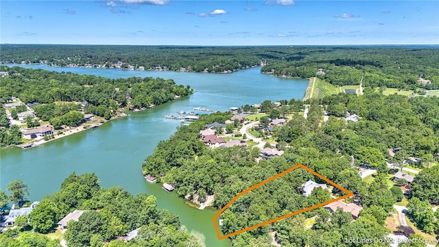 22 Marina Cir, Bella Vista, AR 72715 - aerial view of property's location with a nearby body of water, a heavily wooded area, and property parcel outlined