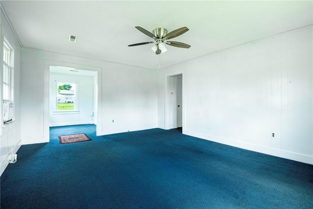 1000 Wilson Ave, Harrison, AR 72601 - unfurnished room with plenty of natural light, dark carpet, a ceiling fan, and baseboards