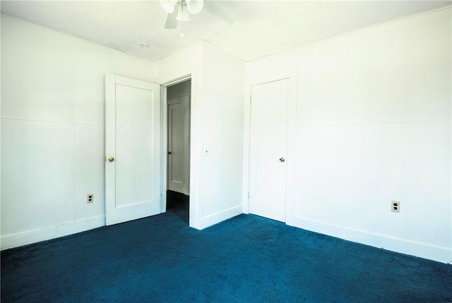 1000 Wilson Ave, Harrison, AR 72601 - unfurnished bedroom featuring dark colored carpet, a closet, a ceiling fan, and baseboards