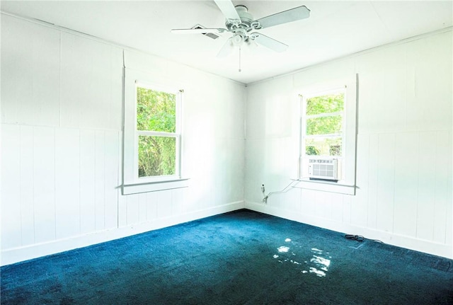 1000 Wilson Ave, Harrison, AR 72601 - carpeted empty room with cooling unit, ceiling fan, a decorative wall, and baseboards