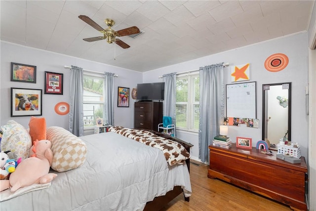 1600 Westwood Ave, Springdale, AR 72762 - bedroom featuring wood finished floors, multiple windows, ornamental molding, and a ceiling fan