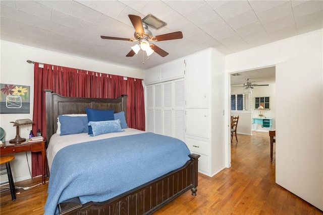 1600 Westwood Ave, Springdale, AR 72762 - bedroom with wood finished floors, a closet, and a ceiling fan
