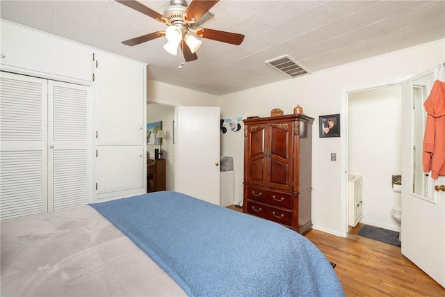 1600 Westwood Ave, Springdale, AR 72762 - bedroom featuring wood finished floors, ceiling fan, and a closet