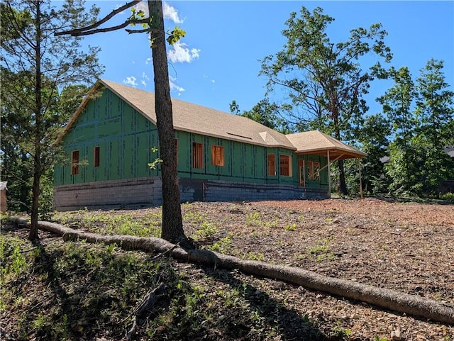 11 Fountainhall Cir, Bella Vista, AR 72715 - view of front of home featuring board and batten siding and a shingled roof