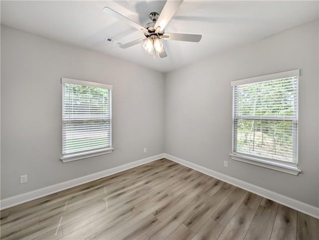 11 Fountainhall Cir, Bella Vista, AR 72715 - spare room with wood finished floors, baseboards, and ceiling fan