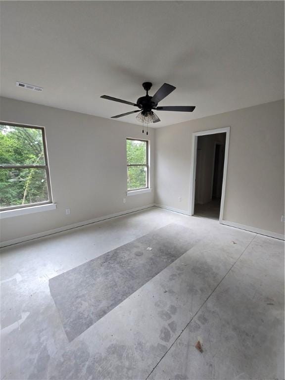 3 Drem Cir, Bella Vista, AR 72715 - unfurnished room featuring baseboards, concrete floors, and ceiling fan