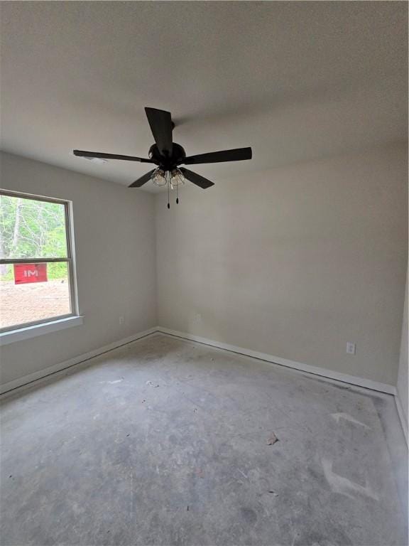 3 Drem Cir, Bella Vista, AR 72715 - unfurnished room featuring concrete floors, baseboards, and a ceiling fan