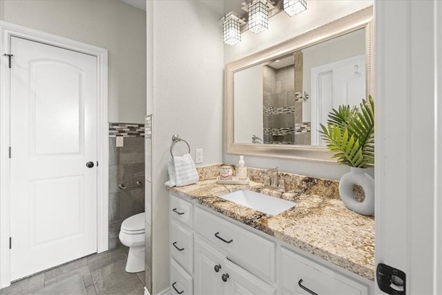 1699 E Bowen Blvd, Fayetteville, AR 72703 - bathroom featuring vanity, a tile shower, and toilet