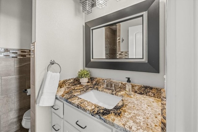 1699 E Bowen Blvd, Fayetteville, AR 72703 - bathroom featuring vanity, toilet, and tile walls