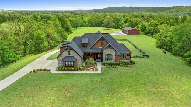 1699 E Bowen Blvd, Fayetteville, AR 72703 - view of front facade with a view of trees, a front yard, and stone siding