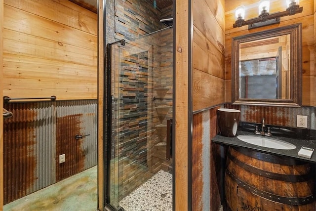1699 E Bowen Blvd, Fayetteville, AR 72703 - bathroom featuring a stall shower, wood walls, and vanity