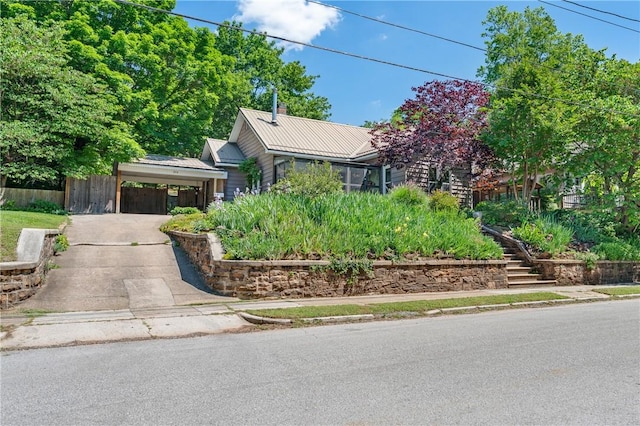 324 E Sutton St, Fayetteville, AR 72701 - obstructed view of property featuring metal roof, stairway, and a standing seam roof