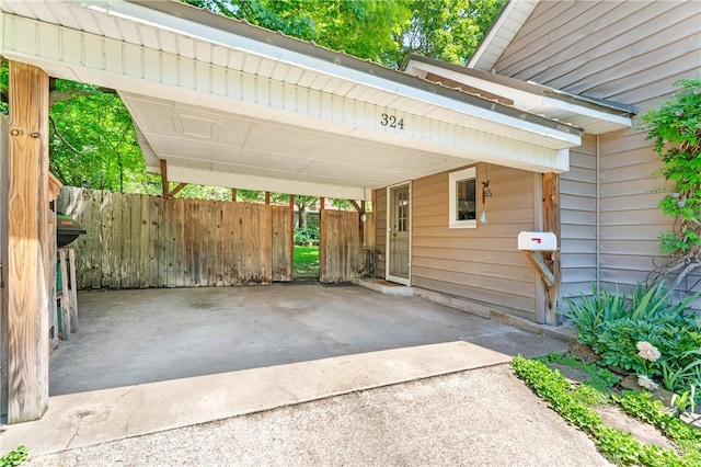 324 E Sutton St, Fayetteville, AR 72701 - view of vehicle parking with an attached carport