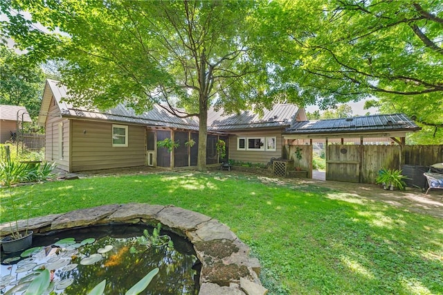 324 E Sutton St, Fayetteville, AR 72701 - back of property featuring a sunroom and metal roof