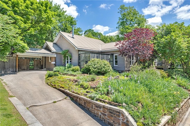 324 E Sutton St, Fayetteville, AR 72701 - single story home with metal roof and driveway