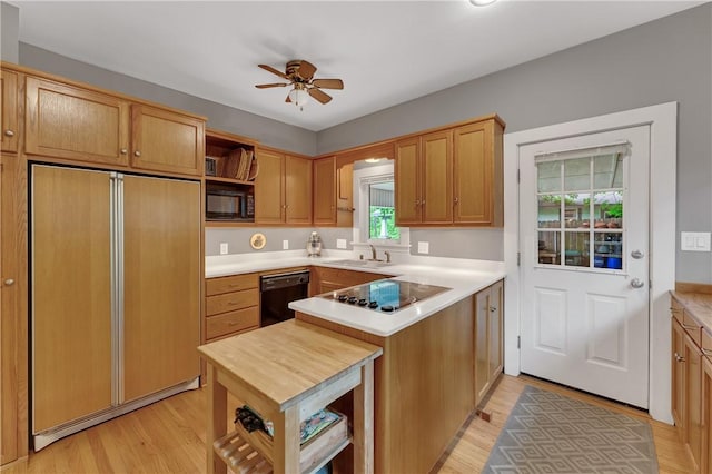 324 E Sutton St, Fayetteville, AR 72701 - kitchen featuring open shelves, black appliances, a sink, ceiling fan, and light wood-style floors