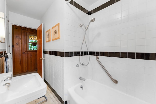 324 E Sutton St, Fayetteville, AR 72701 - full bathroom featuring a sink, washtub / shower combination, tile walls, and tile patterned flooring