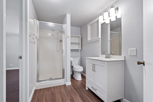 3139 Madison Unit 2405, Huntsville, AR 72740 - full bathroom with a stall shower, wood finished floors, and vanity