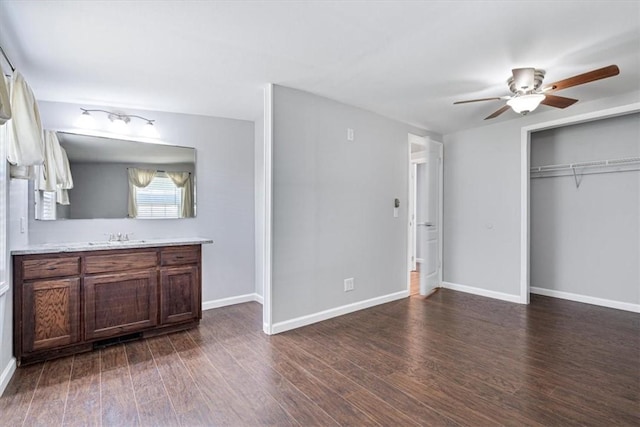 3139 Madison Unit 2405, Huntsville, AR 72740 - unfurnished bedroom featuring dark wood-style floors, a closet, and a ceiling fan