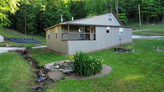 3139 Madison Unit 2405, Huntsville, AR 72740 - view of home's exterior with a yard and a view of trees