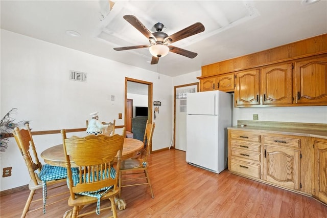 7 Ipswich Dr, Bella Vista, AR 72714 - dining room with a ceiling fan, light wood finished floors, and baseboards